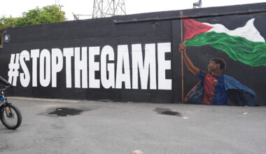 A Deliveroo rider passes the new Lamine Yamal mural outside Bohemians' Dalymount Park, which features the Barcelona star with a Palestinian flag and the words "stop the game", referencing calls to halt the Ireland v Israel European cup fixture. Picture: PA