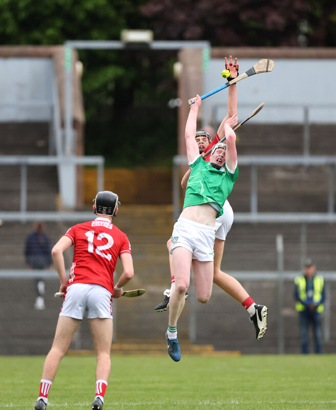Cork captain Eoin Considine contests aerial possession with Limerick's Diarmuid Crowe during the Electric Ireland MHC game at Páirc Uí Rinn. 