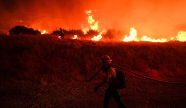A firefighter monitors a wildfire in California (Jae C. Hong/AP)
