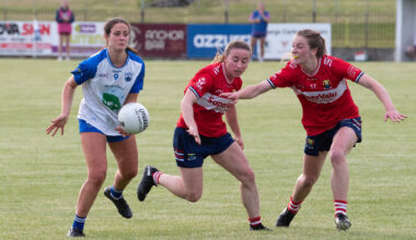 RED SCARE: Waterford's Aine O'Neill about to handpass the ball ahead of Cork players Melissa Duggan and Kate Redmond. Picture: Howard Crowdy