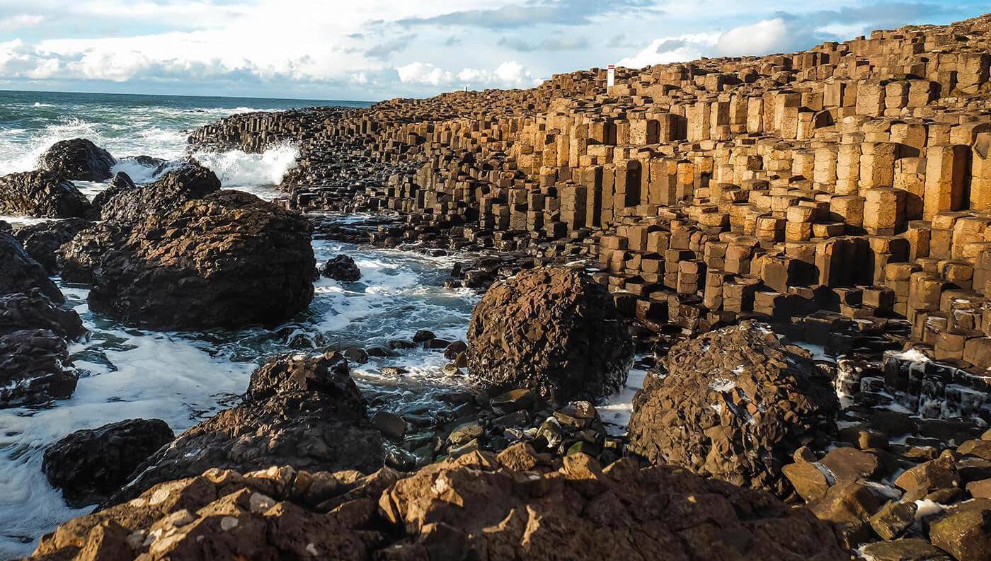The Giant’s Causeway’s distinctive landscape was formed during intense volcanic activity which forced molten rock up through cracks in the earth