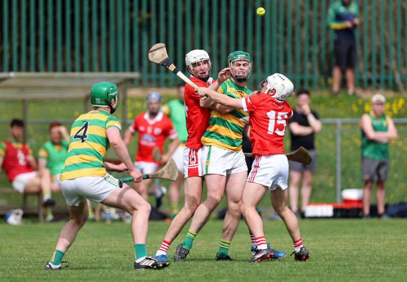  Cathal Cormack of Blackrock gets his handpass away towards his brother Diarmuid, under pressure from Charleville pair Tim Mawe and Garrett Gleeson. Picture: Jim Coughlan