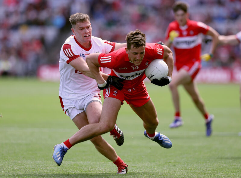Derry's Shane McGuigan is tackled by Kevin O'Donovan of Cork. Picture: John McVitty/INPHO