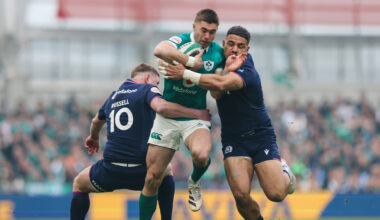 Ireland's Jack Crowley is tackled by Scotland's Sione Tuipulotu and Finn Russell. Pic: Ryan Byrne/Inpho