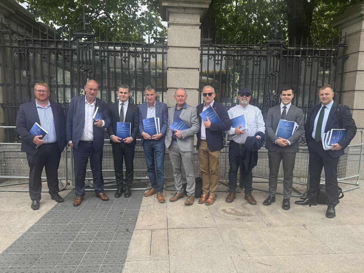 Bill Kenneally’s victims, with solicitor Darragh Mackin, outside Leinster House in Dublin in June. Picture: Bairbre Holmes/PA