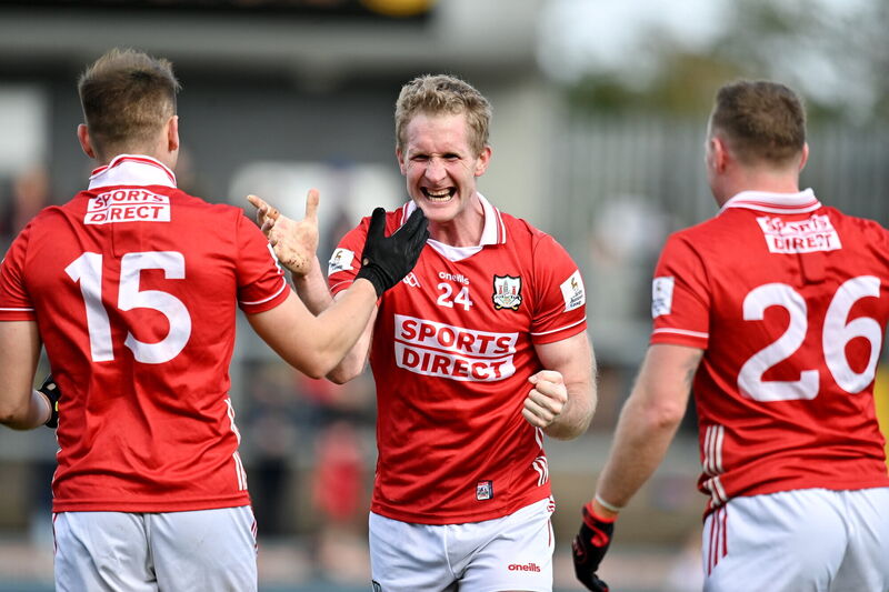 Ruairí Deane of Cork celebrates with Steven Sherlock and Brian Hurley after victory over Tyrone that sealed promotion to Division 1. Picture: Oliver McVeigh/Sportsfile
