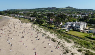 Sunbathers soaked up the sunshine at Burrow Beach in Dublin in May, which saw record-breaking temperatures (PA)