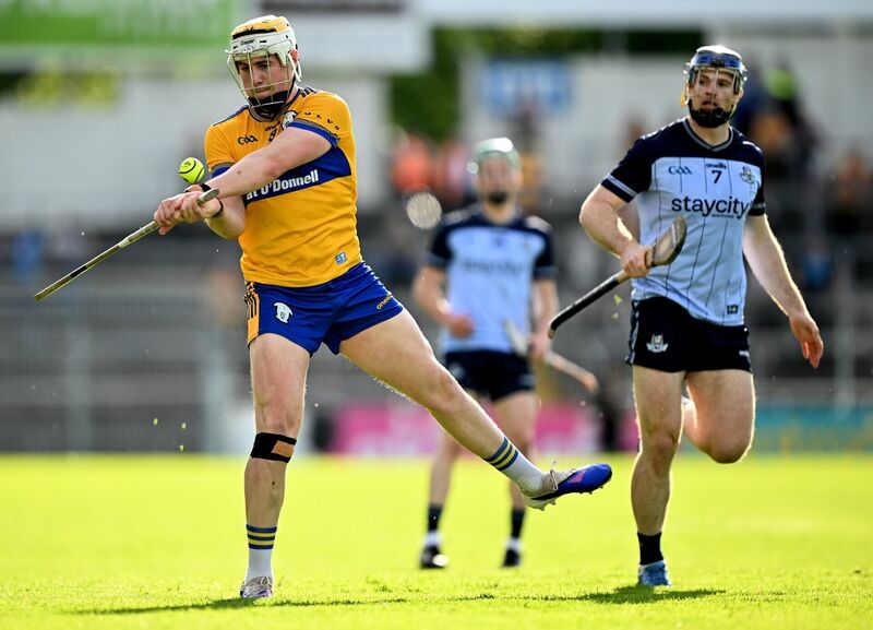 Sean Rynne of Clare in action against Conor Burke. Picture: David Fitzgerald/Sportsfile
