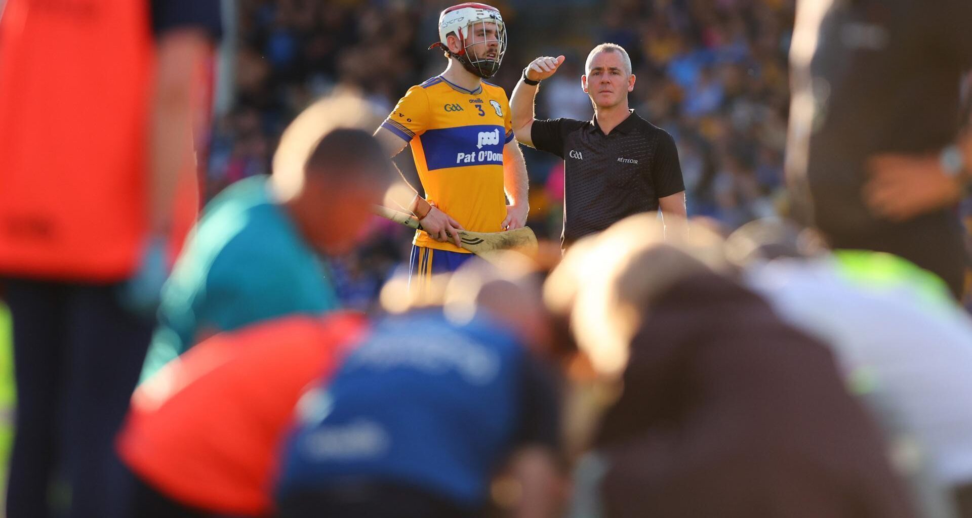 Clare's Conor Leen with referee James Owens as David Reidy receives medical treatment for a serious head injury. Pic: ©INPHO/Tom O'Hanlon