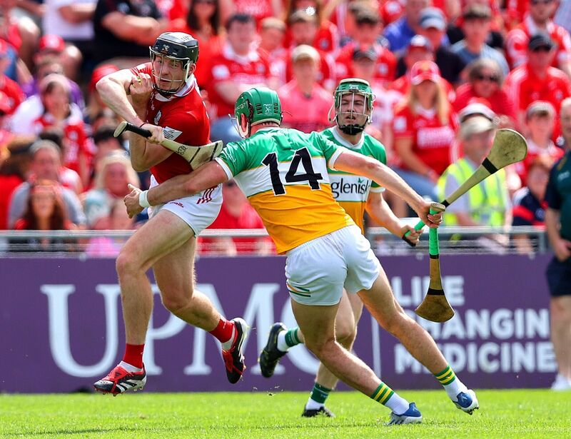 Cork's Eoin Downey tries to get away from Brian Duignan of Offaly. Picture: Inpho/Tom O'Hanlon