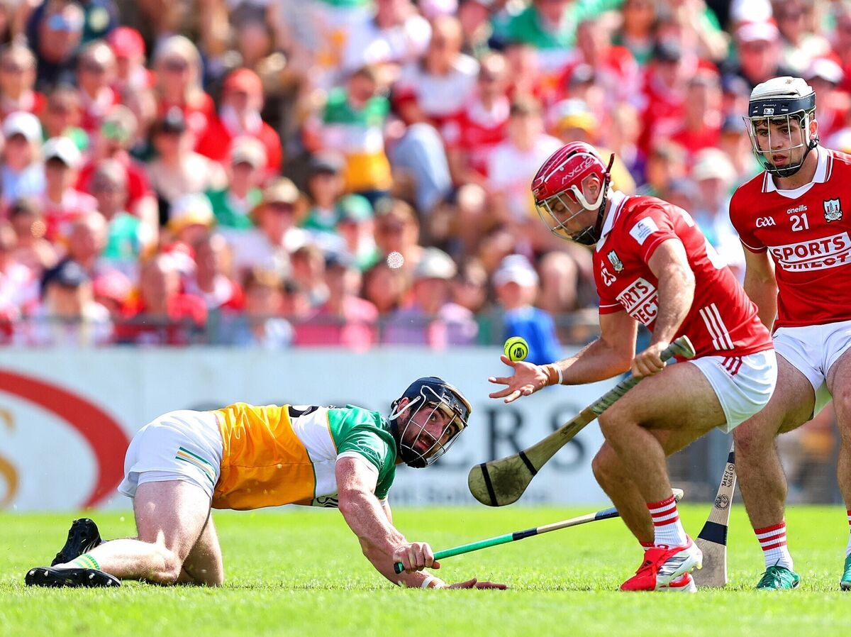 Cork's William Buckley with Ben Conneely of Offaly. Picture: Inpho/Tom O'Hanlon