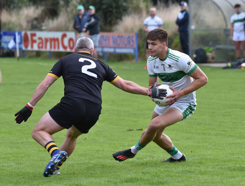 Kanturk's Colin Walsh looking to pass Seán Shanahan of Fermoy. Picture: Dan Linehan