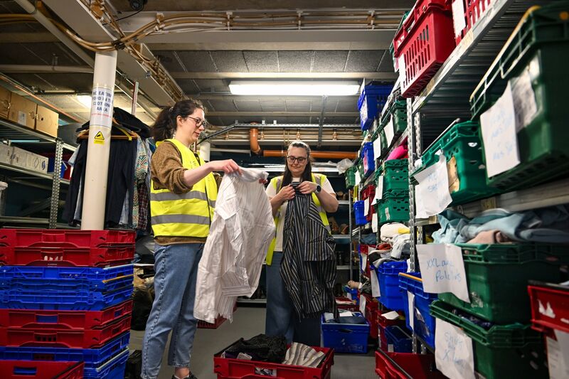Volunteers sort donated clothing at The Lighthouse Café.