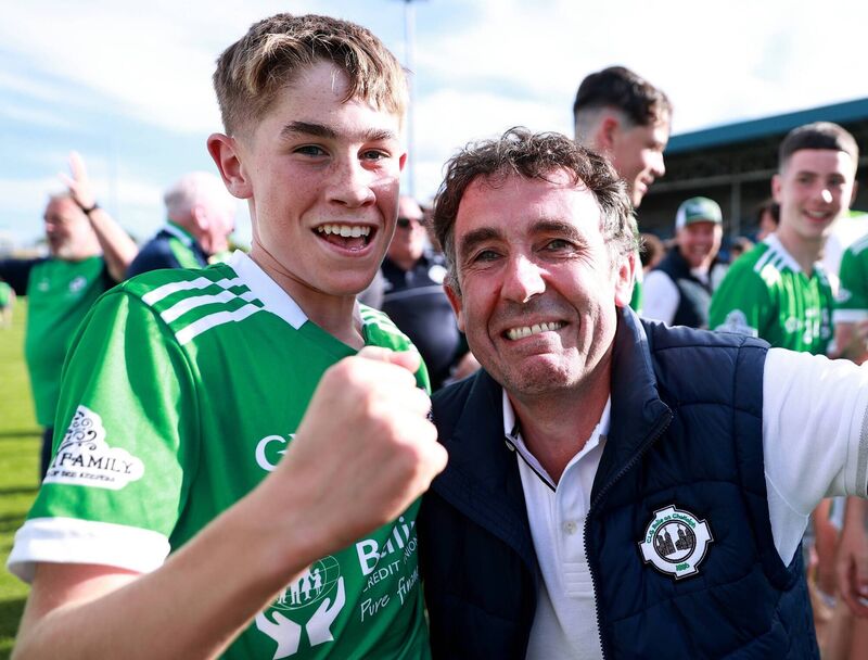 Ballincolig's Ollie Power, scorer of the winning points in the final, celebrating with his father Ed after the victory. Picture: Thomas Flinkow/Sportsfile
