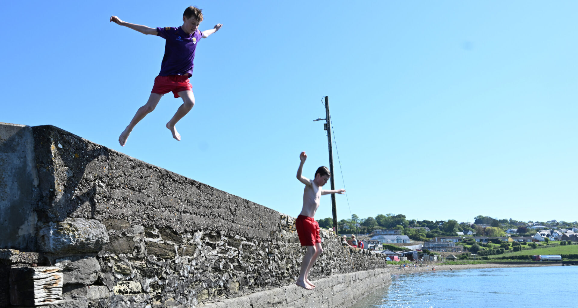 Ronan Lorcan (left) making the most of the sunny weather at Aghada Pier, Co Cork. Picture: Larry Cummins