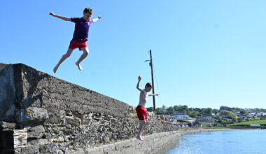 Ronan Lorcan (left) making the most of the sunny weather at Aghada Pier, Co Cork. Picture: Larry Cummins