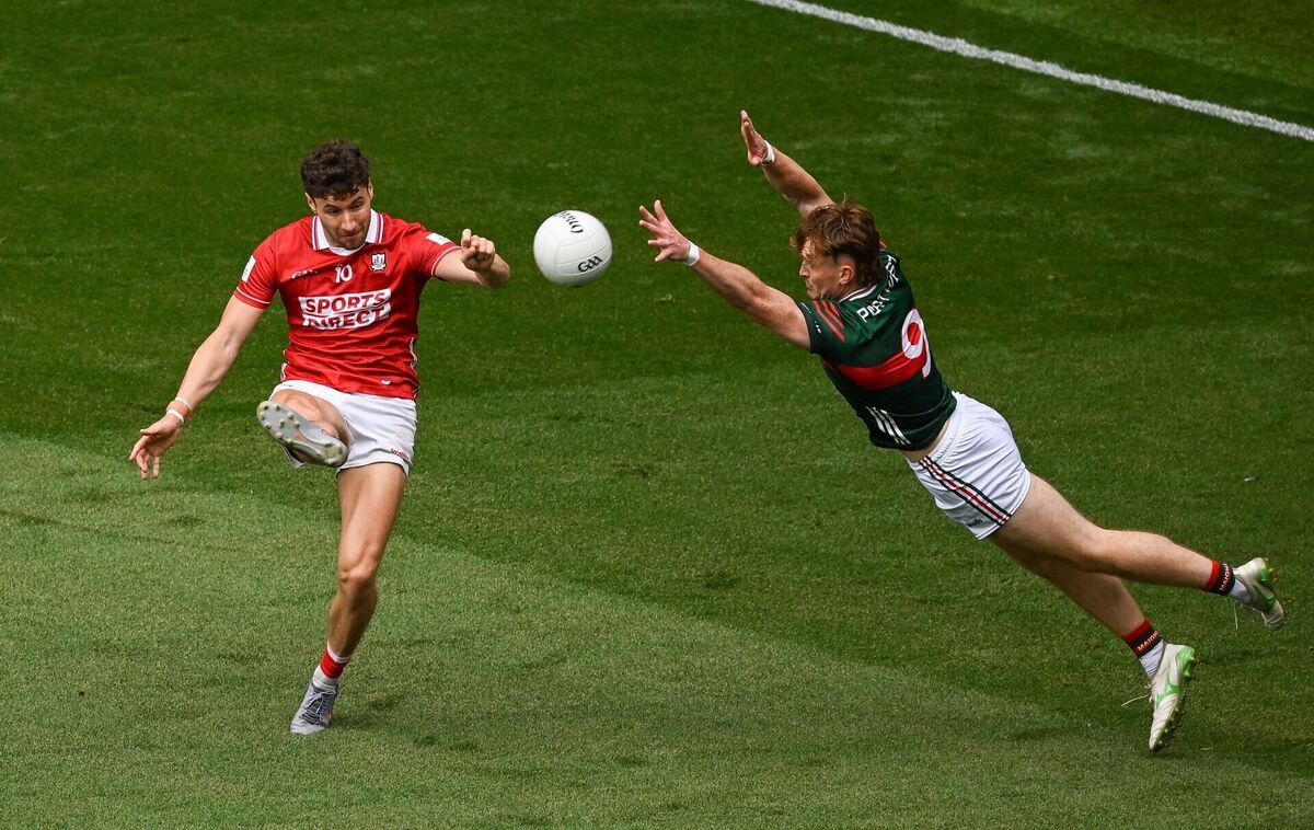 Paul Walsh of Cork scores a point despite the efforts of Jack Carney of Mayo. Picture: Sam Barnes/Sportsfile