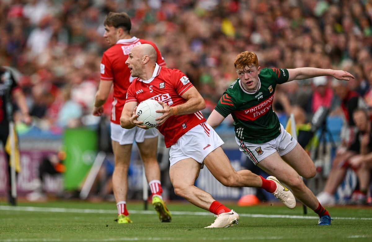 Brian O'Driscoll of Cork in action against Darragh Beirne of Mayo. Picture: Ramsey Cardy/Sportsfile