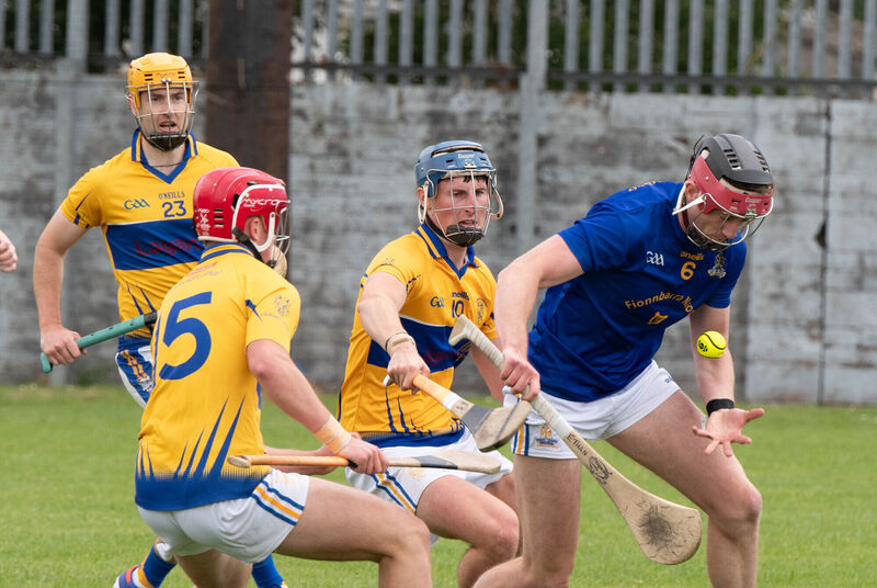 St Finbarr's Ethan Twomey holds possession ahead of Carrigtwohill's Cillian Barry and Patrick Walsh. Picture: Howard Crowdy