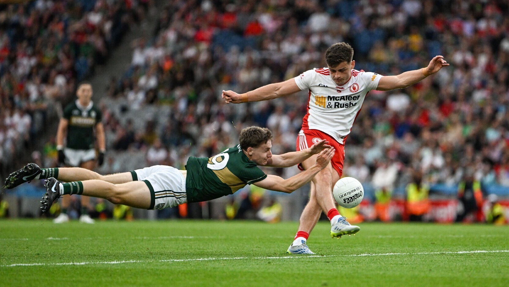 Keith Evans made a critical block on Michael McKernan as he wound up for a two-point effort which could have taken the game to extra-time. Pic: Ray McManus/Sportsfile