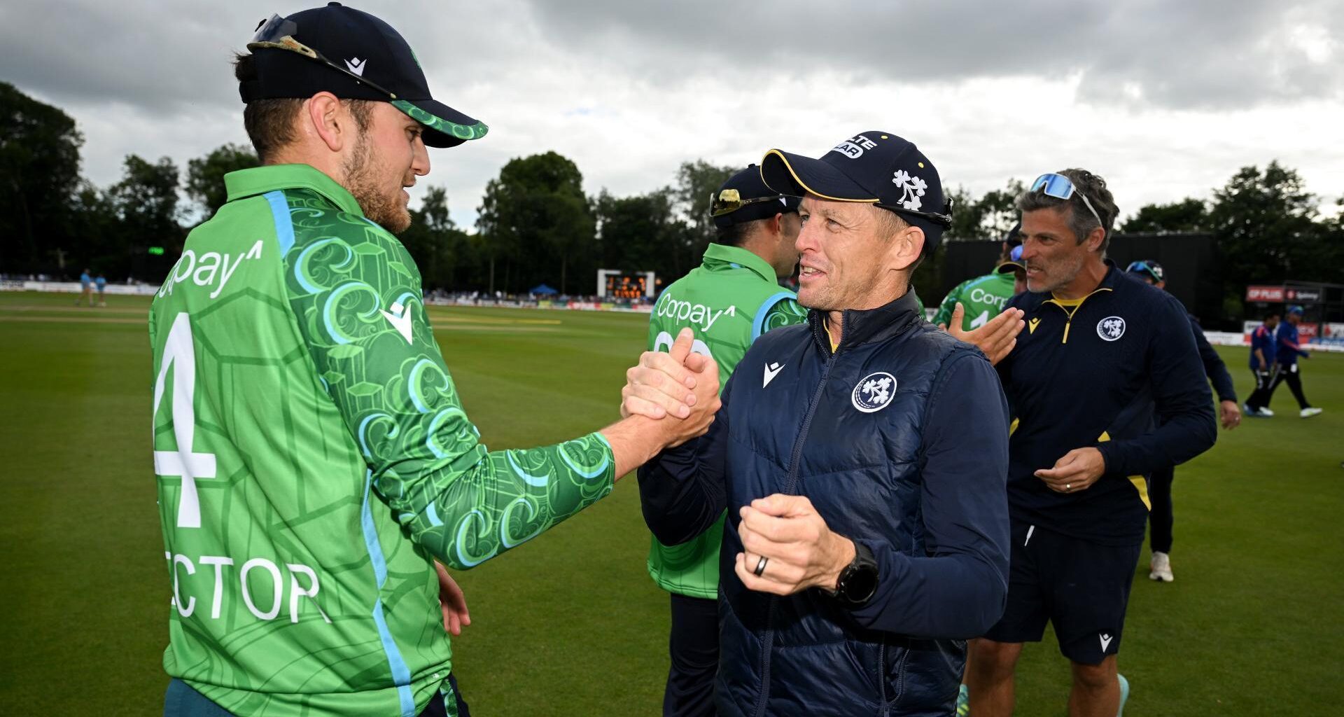 Ireland head coach Heinrich Malan and Tim Tector celebrate after Sunday's match two in Belfast. Pic: Ramsey Cardy/Sportsfile