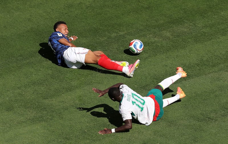 Kylian Mbappé after a challenge by Sadio Mané. Photograph: Darrian Traynor/Getty Images