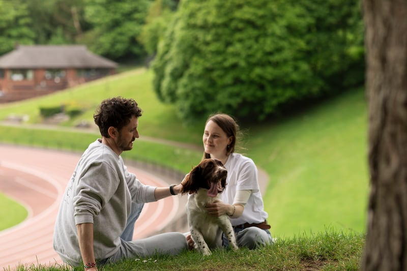 Ciara Mageean, her partner Tommy and her dog Sammy at the Mary Peters Track in Belfast. Photograph: Evanna Devine