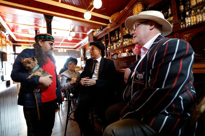 Jasper Kearns (with Milly the dog), Macdara Boyd, Stephen Boyd and Johnny Bell on Bloomsday. Photograph: Nick Bradshaw/The Irish Times