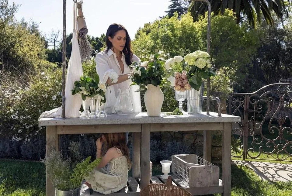 Princess Lilibet looked to be enjoying the flowery activity