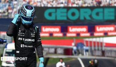 George Russell celebrates after claiming pole position in Austria
