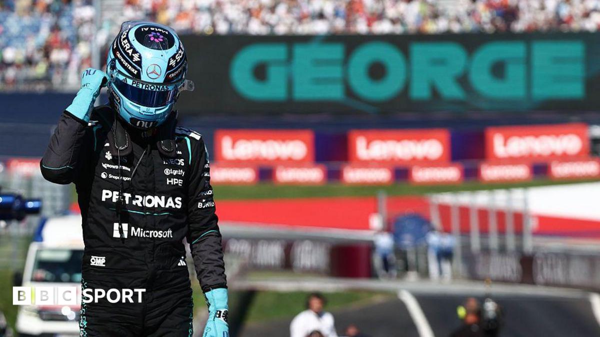George Russell celebrates after claiming pole position in Austria