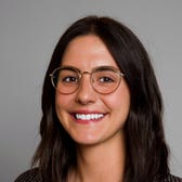Kelsey Vlamis's face on gray background.