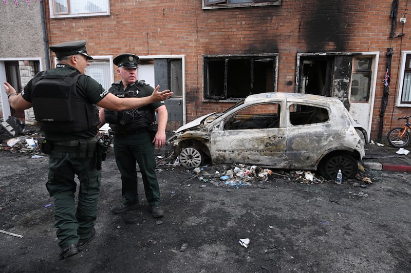 Police on Lendrick Street in Belfast following a night of anti-immigrant riots. Photo: Charles McQuillan/Getty Images