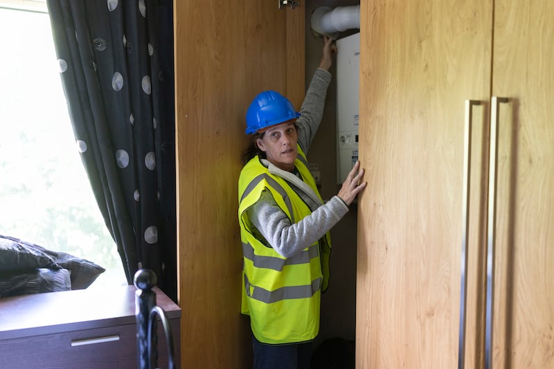 Helga Muir in her fire-damaged apartment bedroom in Auburn Park. Photograph: Chris Maddaloni/The Irish Times