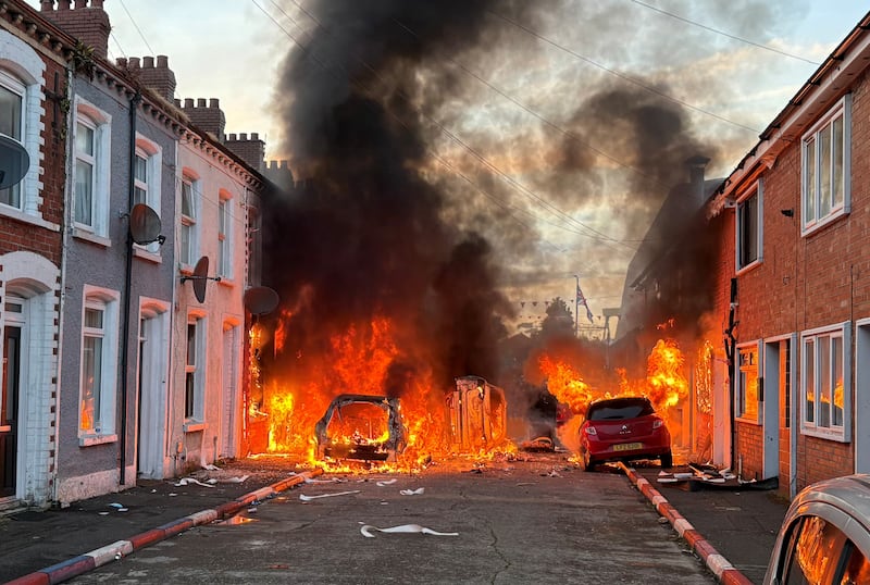 Vehicles set on fire on Lendrick Street in Belfast. Photograph: PA/PA Wire



