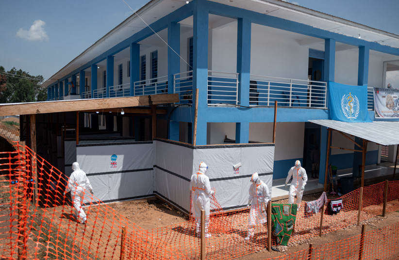 DRCONGO-HEALTH-EBOLA EDITORS NOTE: Graphic content / Medical staff walk towards the doffing and decontamination station at the Evangelical Medical Center of Nyankunde (CME) after providing care to patients suffering from or suspected of having Ebola virus disease in Bunia, Ituri Province, Democrati (credit: Jospin Mwisha / AFP via Getty Images) DRCONGO-HEALTH-EBOLA EDITORS NOTE: Graphic content / Medical staff walk towards the doffing and decontamination station at the Evangelical Medical Center of Nyankunde (CME) after providing care to patients suffering from or suspected of having Ebola virus disease in Bunia, Ituri Province, Democrati (credit: Jospin Mwisha / AFP via Getty Images)