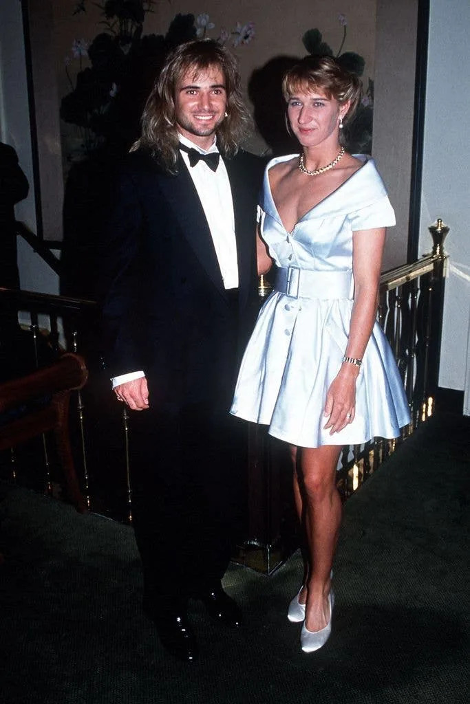 Andre Agassi of USA and Steffi Graf of Germany pose for photographers at the Champions Ball for the Wimbledon Tennis Championships in 1992