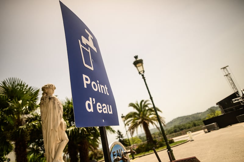 A sign bearing the inscription 'Water Point' in French at a public drinking water facility in the city centre during a heatwave in Pau on Sunday. Photograph: Quentin Top/Hans Lucas/AFP via Getty