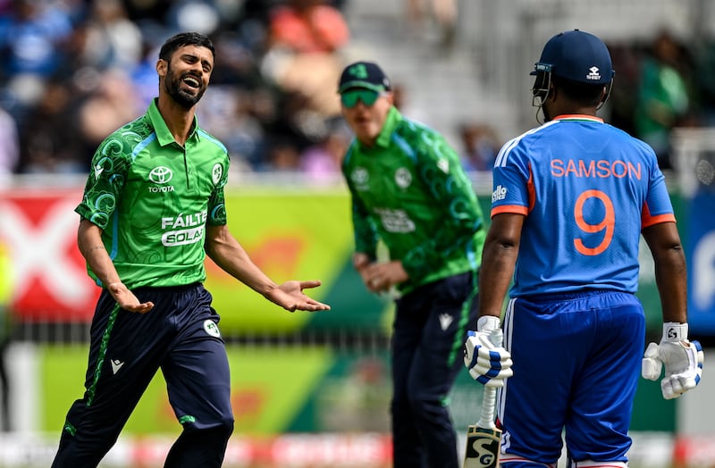 Ireland's Jai Moondra celebrates taking the wicket of Sanju Samson of India during the game at Stormont. Photograph: Ramsey Cardy/Sportsfile