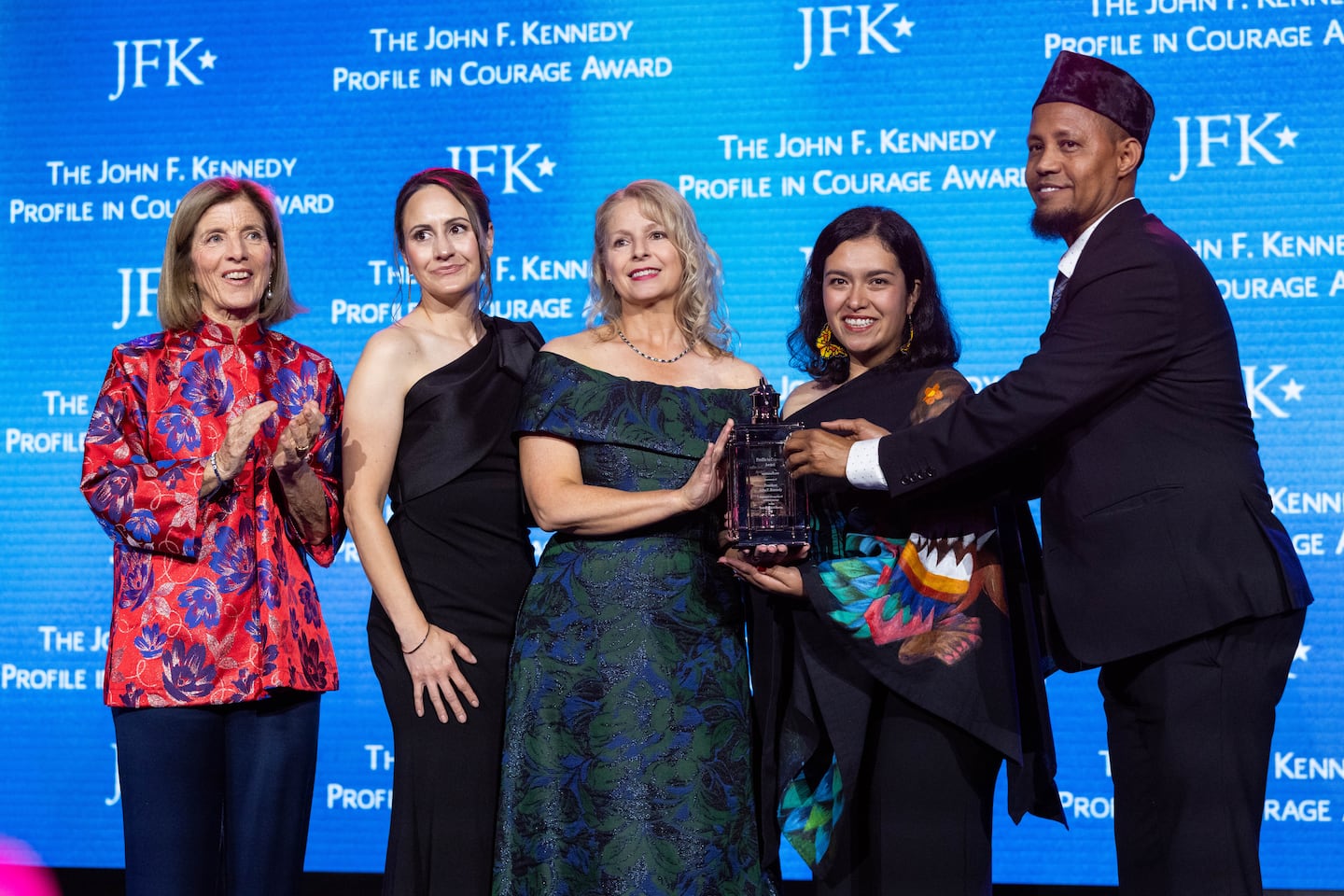 Caroline Kennedy, left, stands with Natalie Ehret, (from left) Zena Stenvik, Carolina Ortiz and Imam Yusuf Abdulle after they received the 2026 John F. Kennedy Profile in Courage Award Sunday night in Boston.