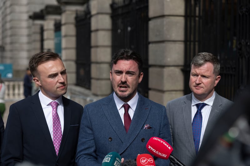 Naoise Ó Cearúil (centre) and Malcolm Byrne (right) outside Leinster House. Photograph: Sam Boal/Collins