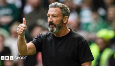 Hearts head coach Derek McInnes gives a thumbs up while standing on the touchline