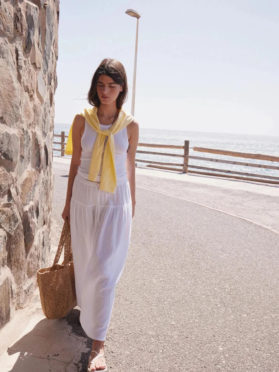 Too hot for denim? A white midi skirt is a summer staple