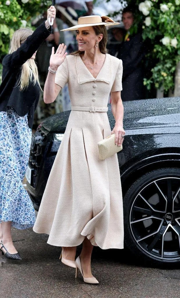 A photo of Kate Middleton waving