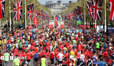 Runners cross the finish line at the London Marathon