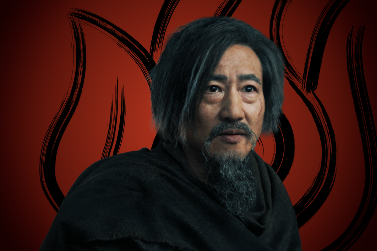Terry Chen as Jeong Jeong with a beard in a dark robe, standing in front of a red background featuring bold, black flame-like symbols. The setting suggests a dramatic or fantasy environment.