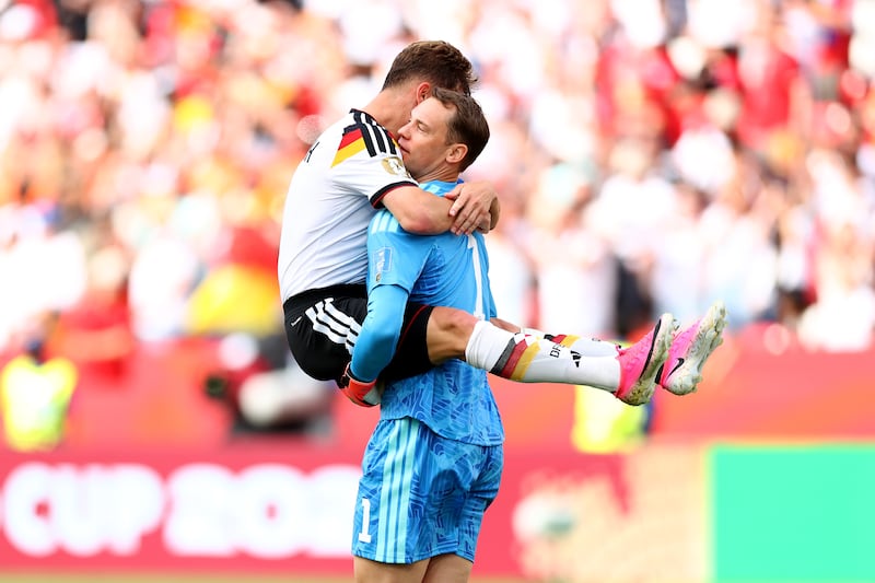 Joshua Kimmich and Manuel Neuer celebrate Germany's 2-1 over Ivory Coast, which secured their passage to the last 32. Photograph: Robert Cianflone/Getty Images
