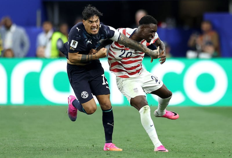 Folarin Balogun (right) of USA in action against Gustavo Gomez of Paraguay during the Fifa World Cup 2026 group stage match in Los Angeles. Photograph: EPA