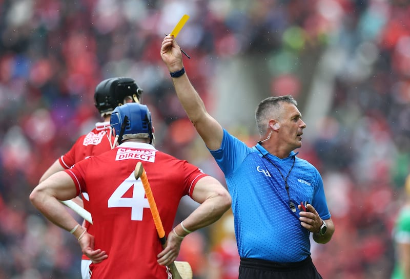 Referee James Owens yellow cards Seán O'Donoghue of Cork. Photograph: James Crombie/Inpho