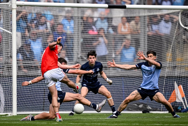 Craig Lennon of Louth shoots to score his side's fourth and winning goal during the GAA Football All-Ireland Senior Championship Round 1 match between Dublin and Louth at Croke Park in Dublin